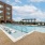 Swimming pool with sun deck and areas for seating and relaxing